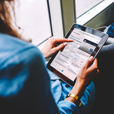 Commuter using CMEssentials+ on tablet.