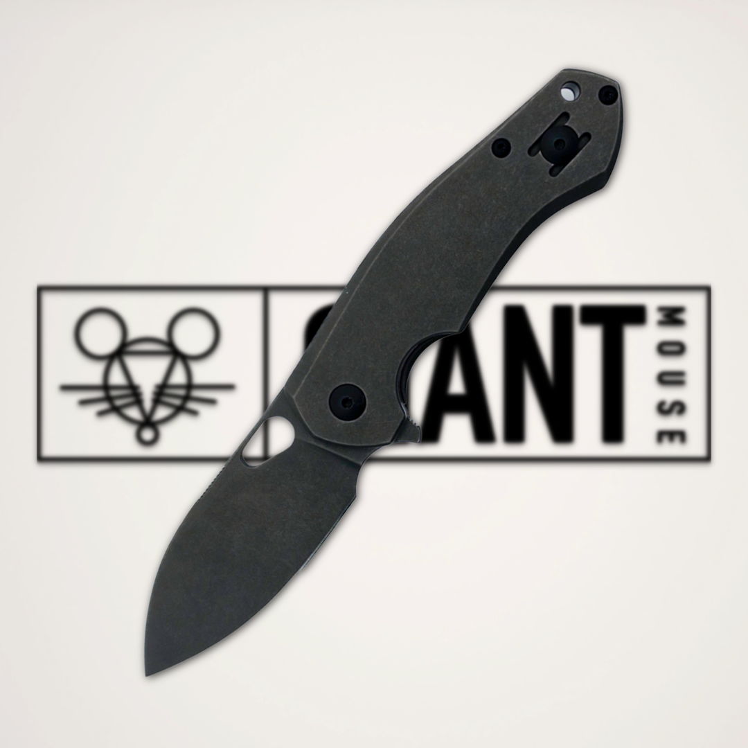 A black folding knife on a light background with a logo.