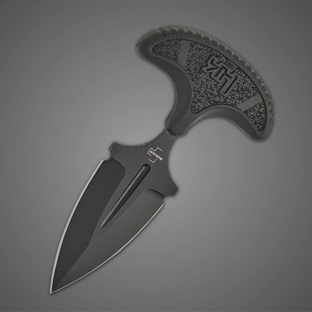 Black tactical knife with a unique handle design on a gray background.