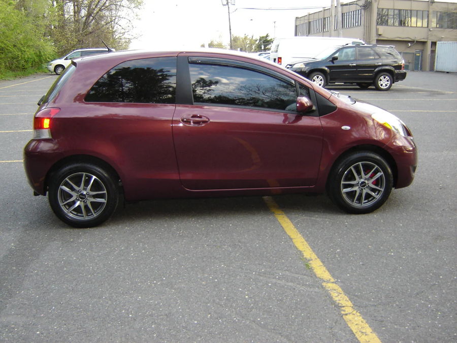 Side profile Frank's maroon 2010 Toyota Yaris three-door hatchback alloy wheels tinted windows Shocker XL train horn featured customer install gallery photo 1