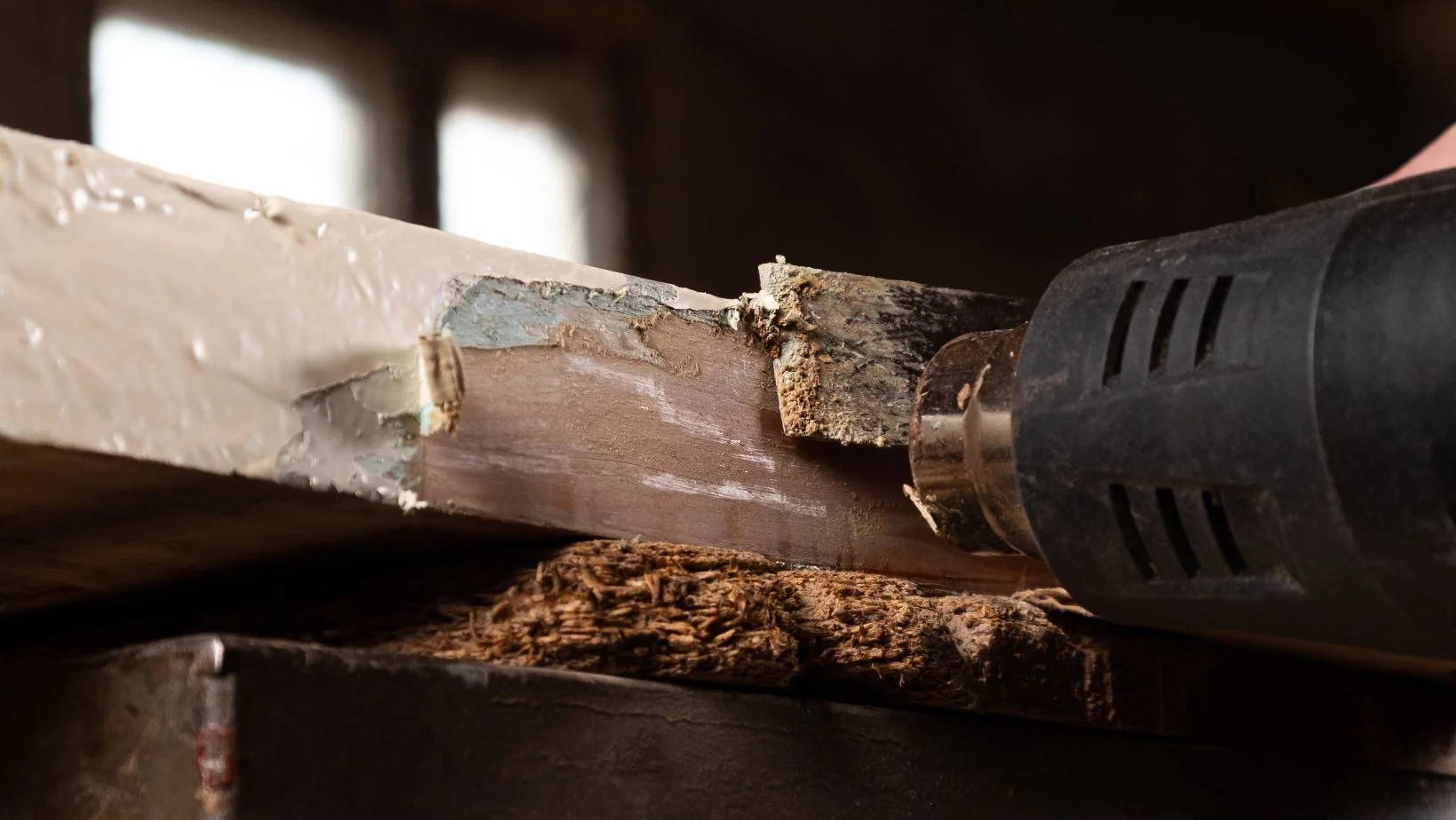 Removing Paint from a Wooden Door with Heat Gun Closeup