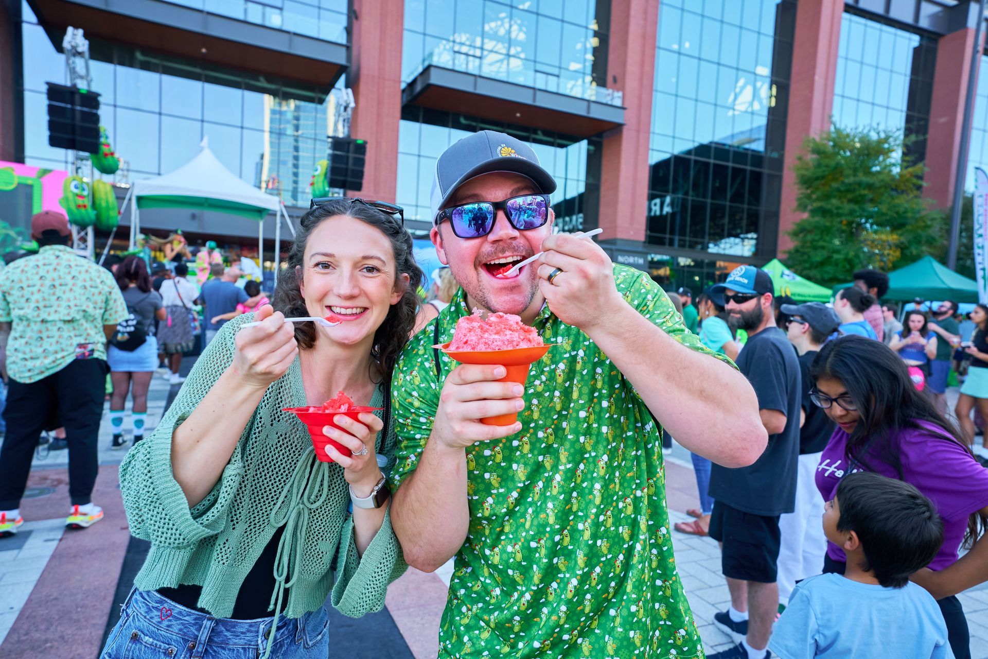 Two guests enjoy snow cones at The Big Dill pickle festival, Globe Life Field and Texas Live!, Arlington Texas 2025