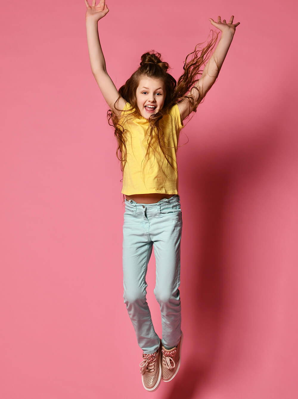 Young Girl Jumping In The Air