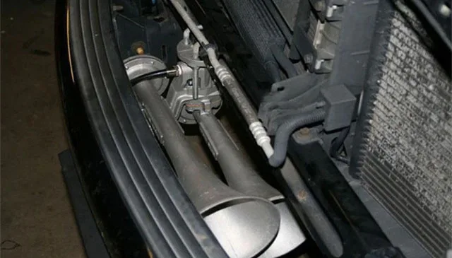 Wayne's 2003 Dodge Ram — compressor, tank, or air-system mounting in the engine bay