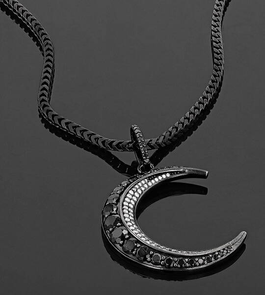 Black and white diamond crescent moon pendant on black silver chain designed by Sheryl Lowe.