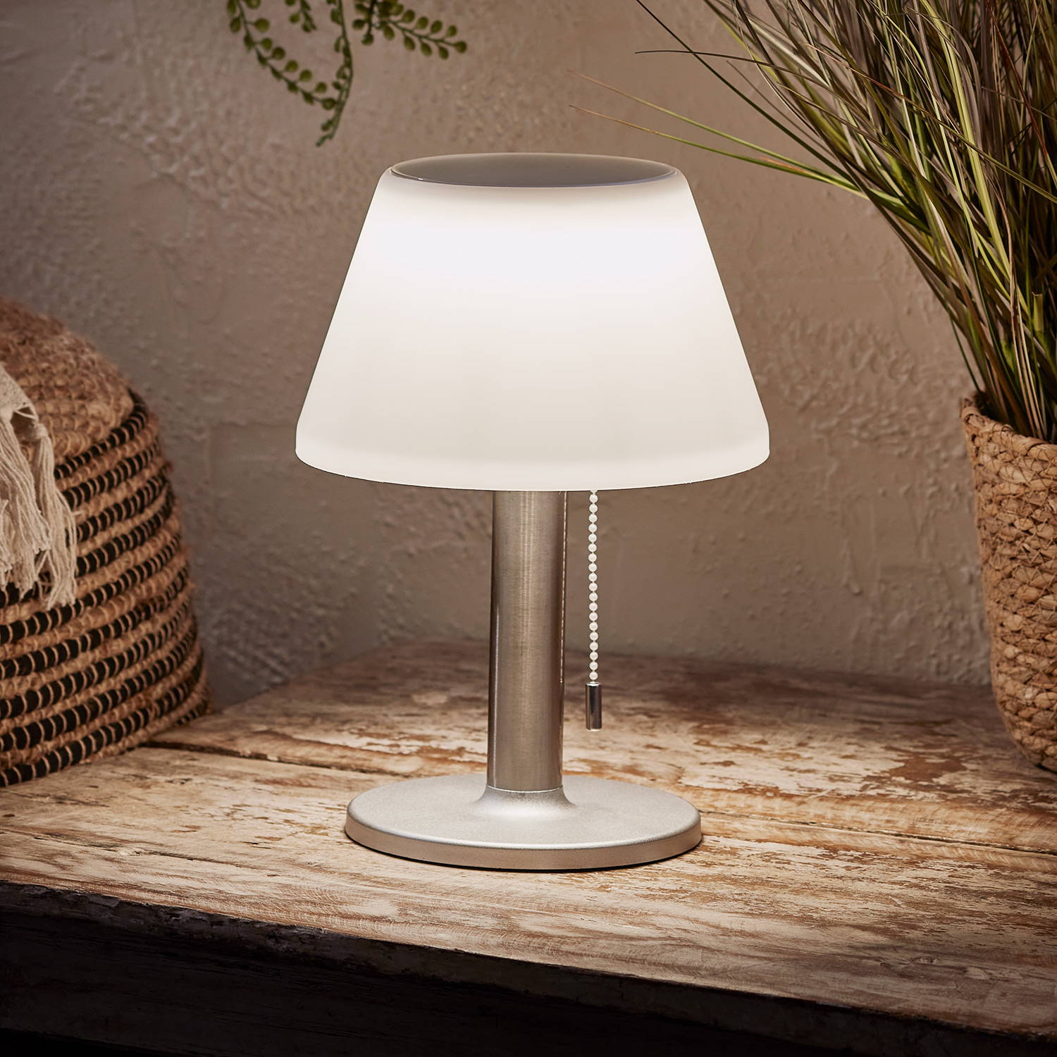 Outdoor solar lamp on a wooden surface