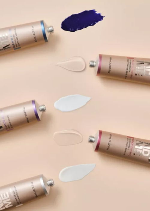 Three tubes of paint with swatches on a beige background.