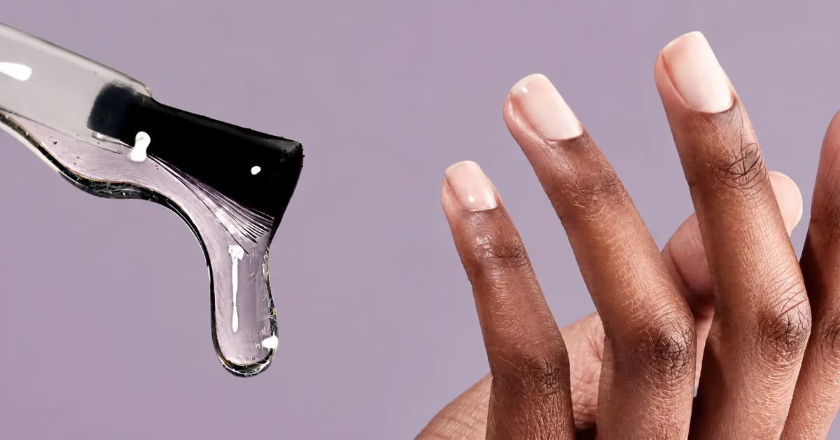 A hand with manicured nails near a dripping tool.