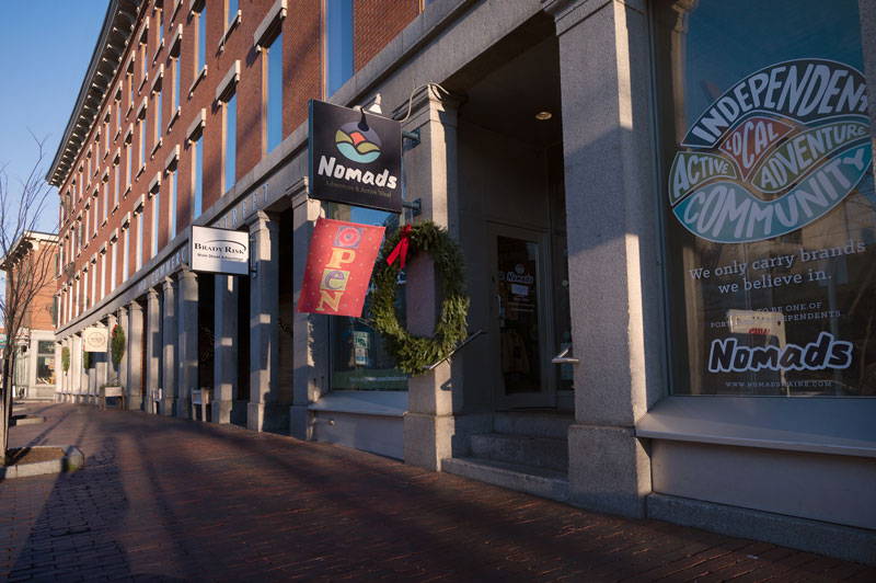 Exterior of Nomad's Adventure and Activewear storefront in Portland, Maine.