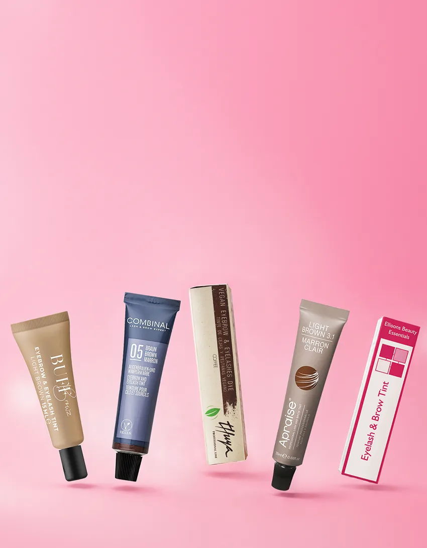 Various cosmetic tubes against a pink background.