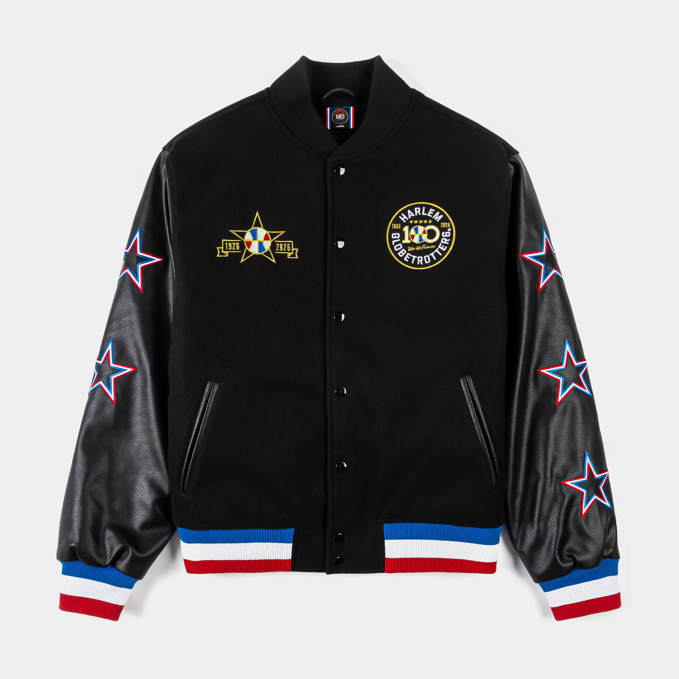 Black varsity jacket with leather sleeves and star designs.