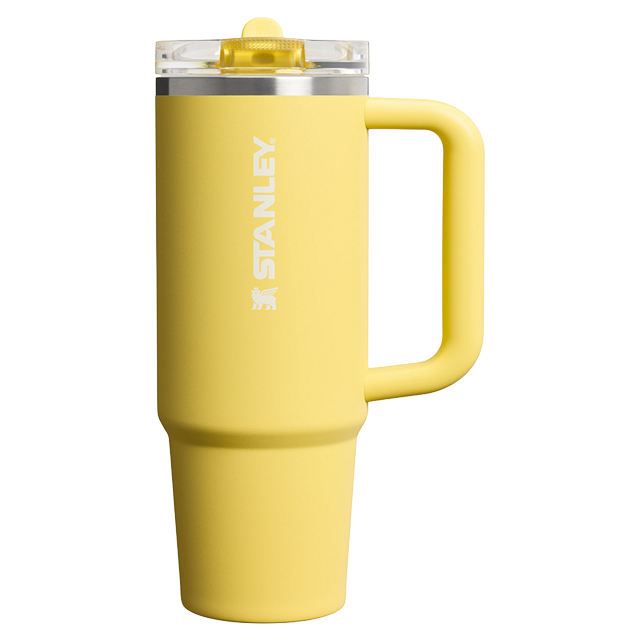 Yellow insulated tumbler with a handle and clear lid.