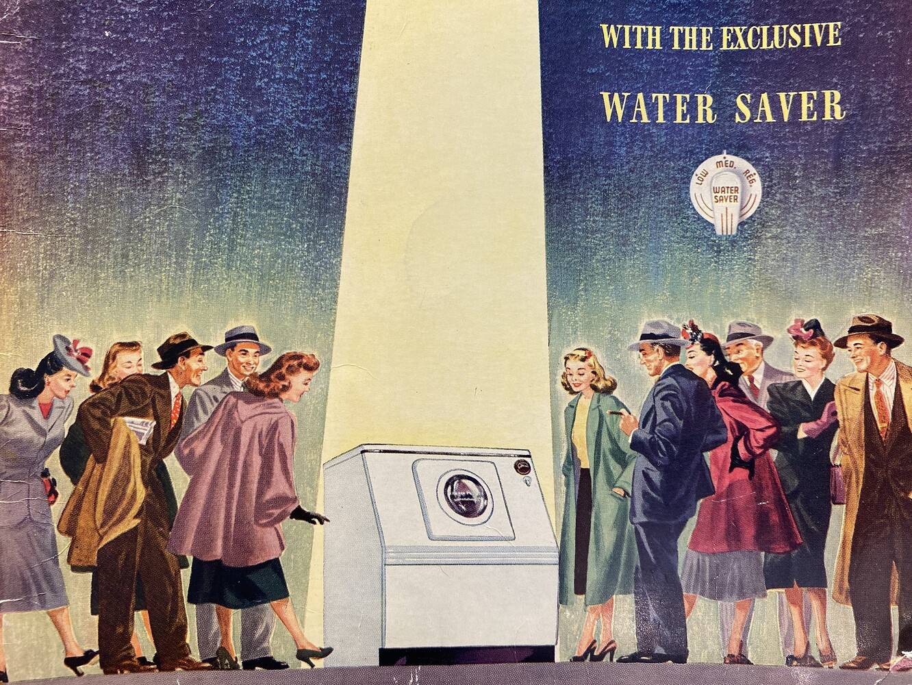 Close up of the cover of a Westinghouse Laundromat washing machine brochure. It features a laundry washing machine in the center with a spotlight shining on it while several Caucasian men and women  in suits and dresses marvel at it.