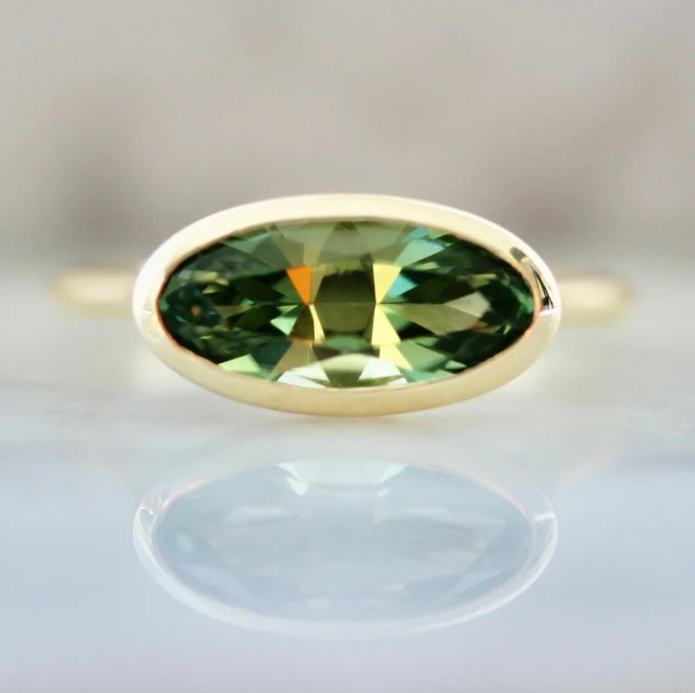 Green tourmaline ring in 14k yellow gold bezel setting by Gem Breakfast