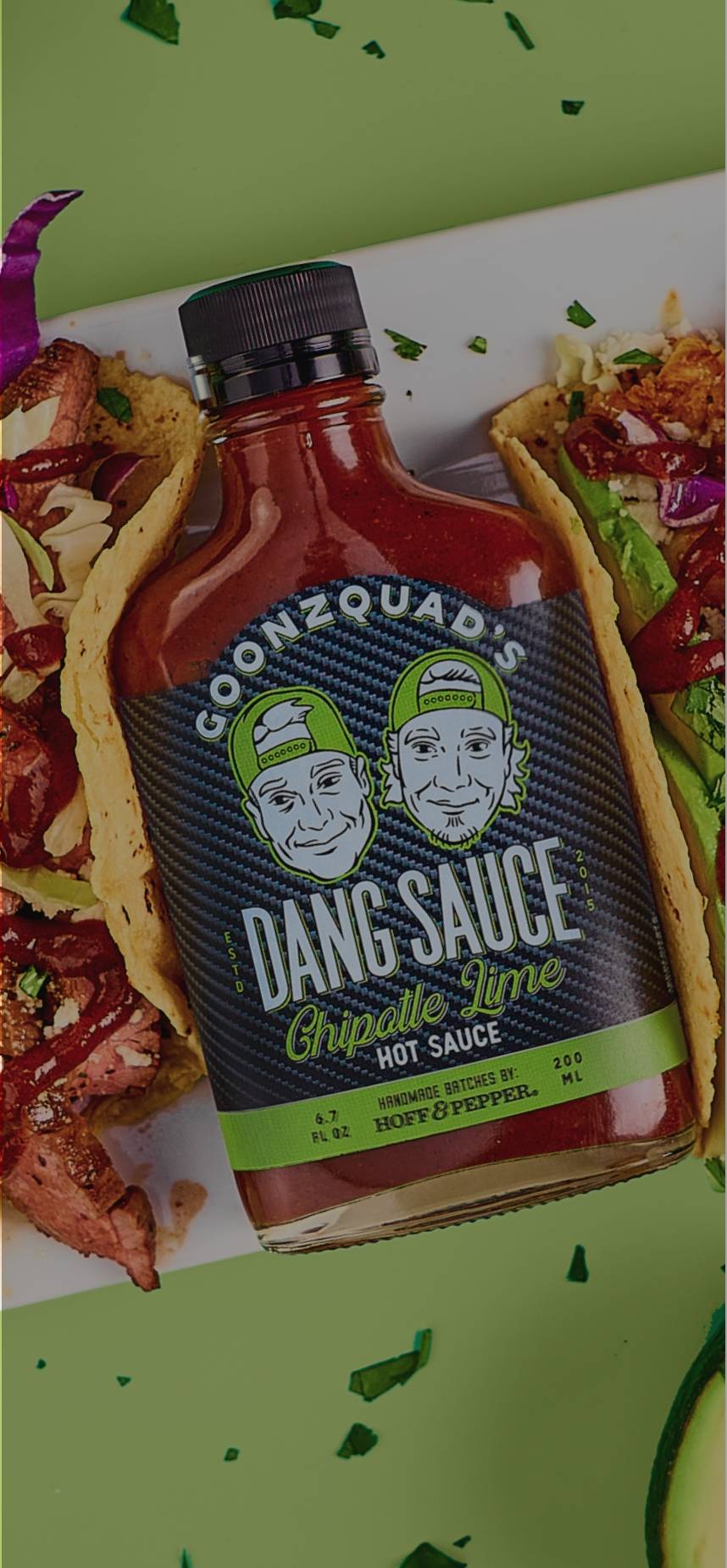 Delicious plate of tacos with bottle of Dang Sauce 