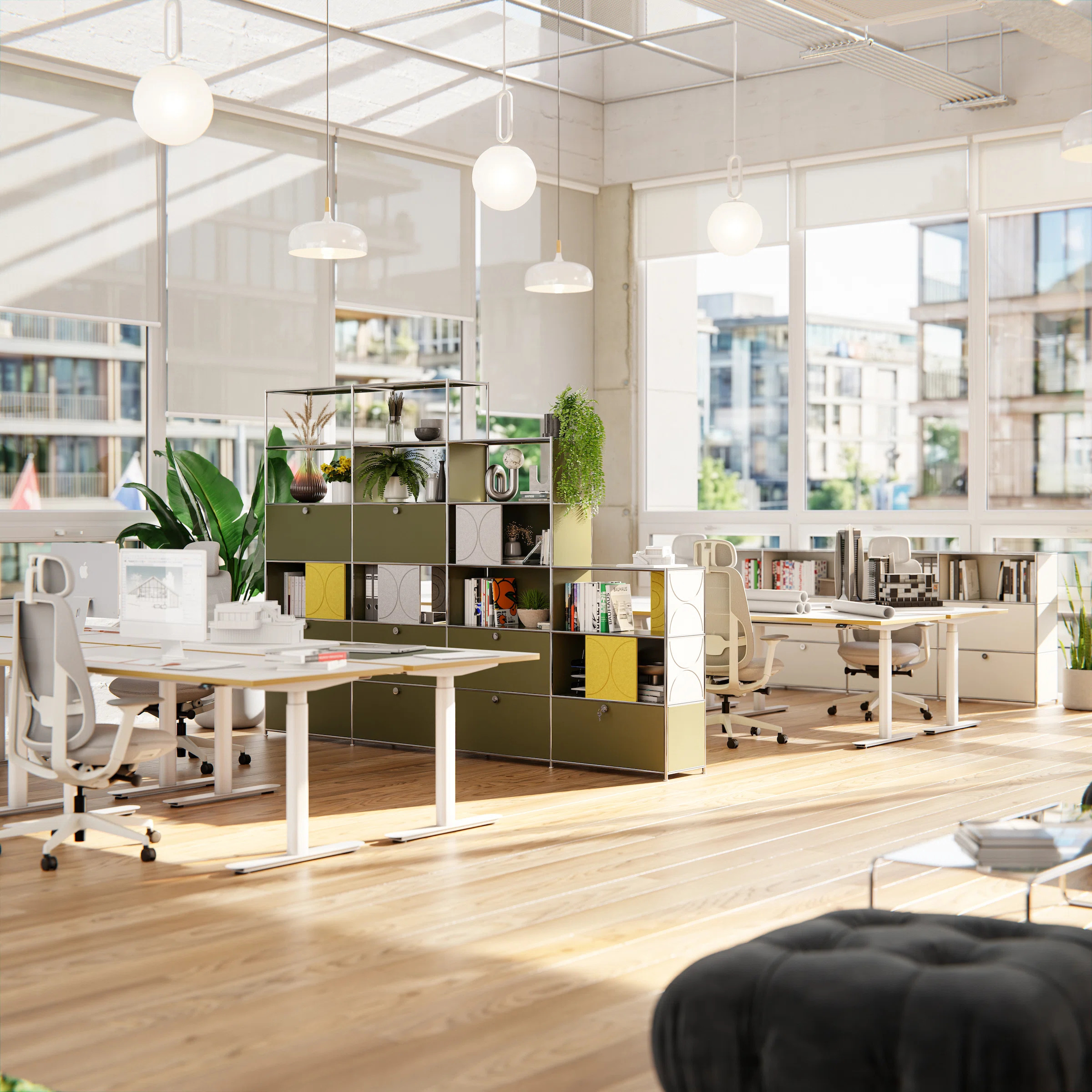 A large olive-green "ofinto" Cubox shelving system serves as a stylish room divider in a bright open-plan office, combined with yellow and light gray soft felt panels to provide visual structure and improve acoustics.