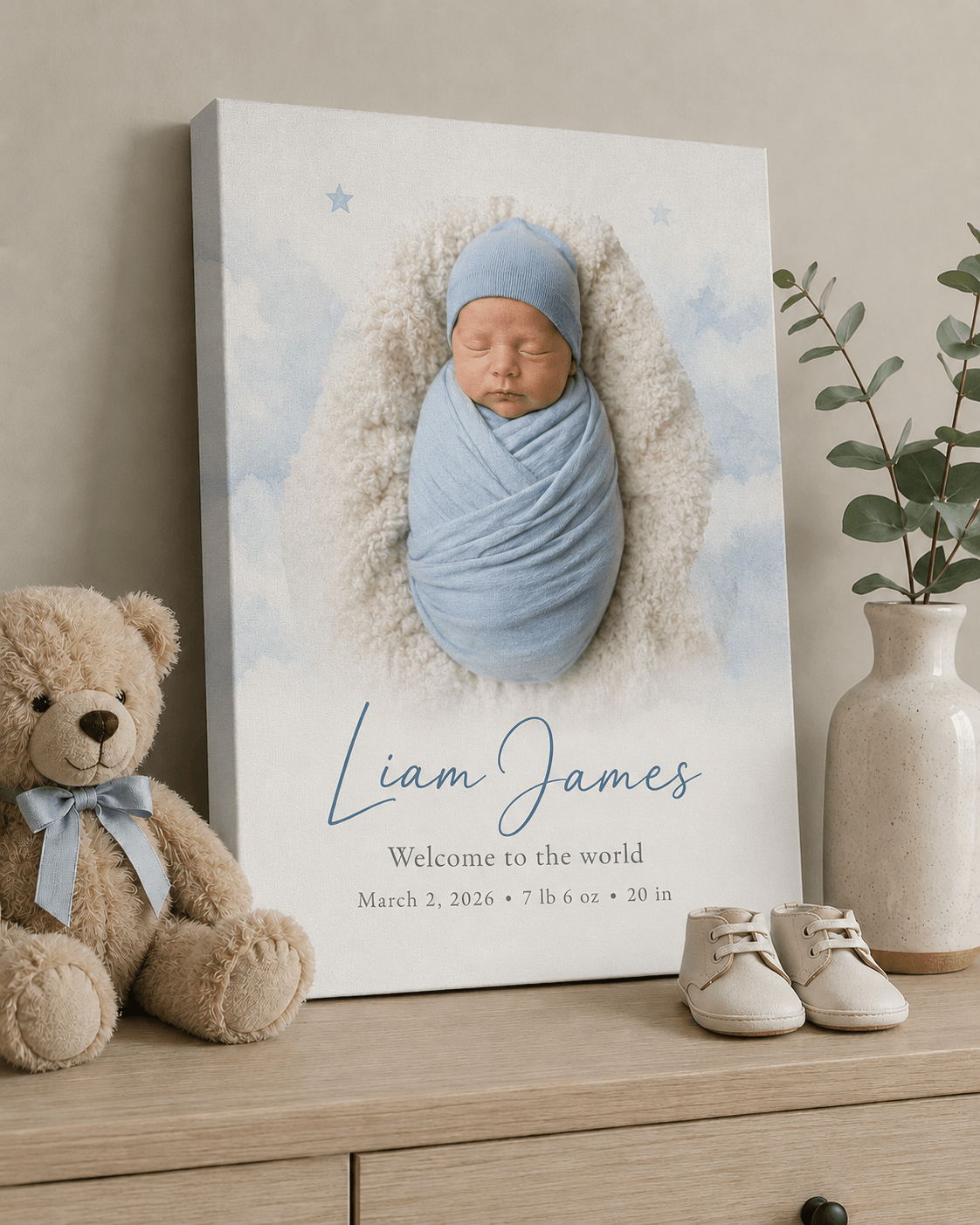 Baby portrait with name and birth details, teddy bear, and shoes.