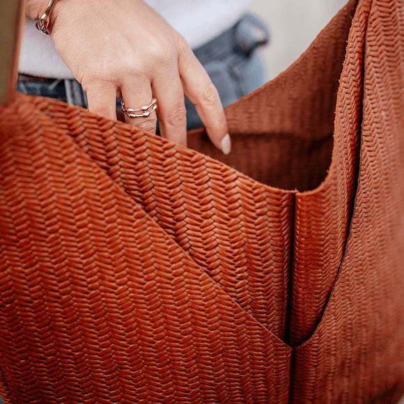 closeup on brown basketweave bag
