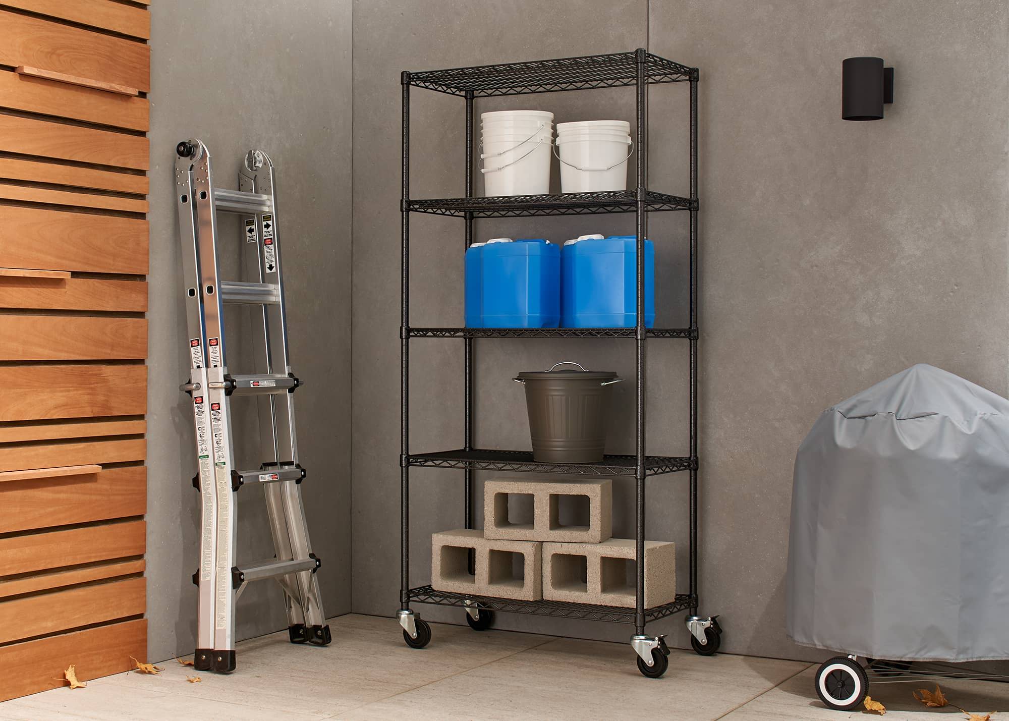 outdoor wire shelving rack with wheels filled with construction supplies