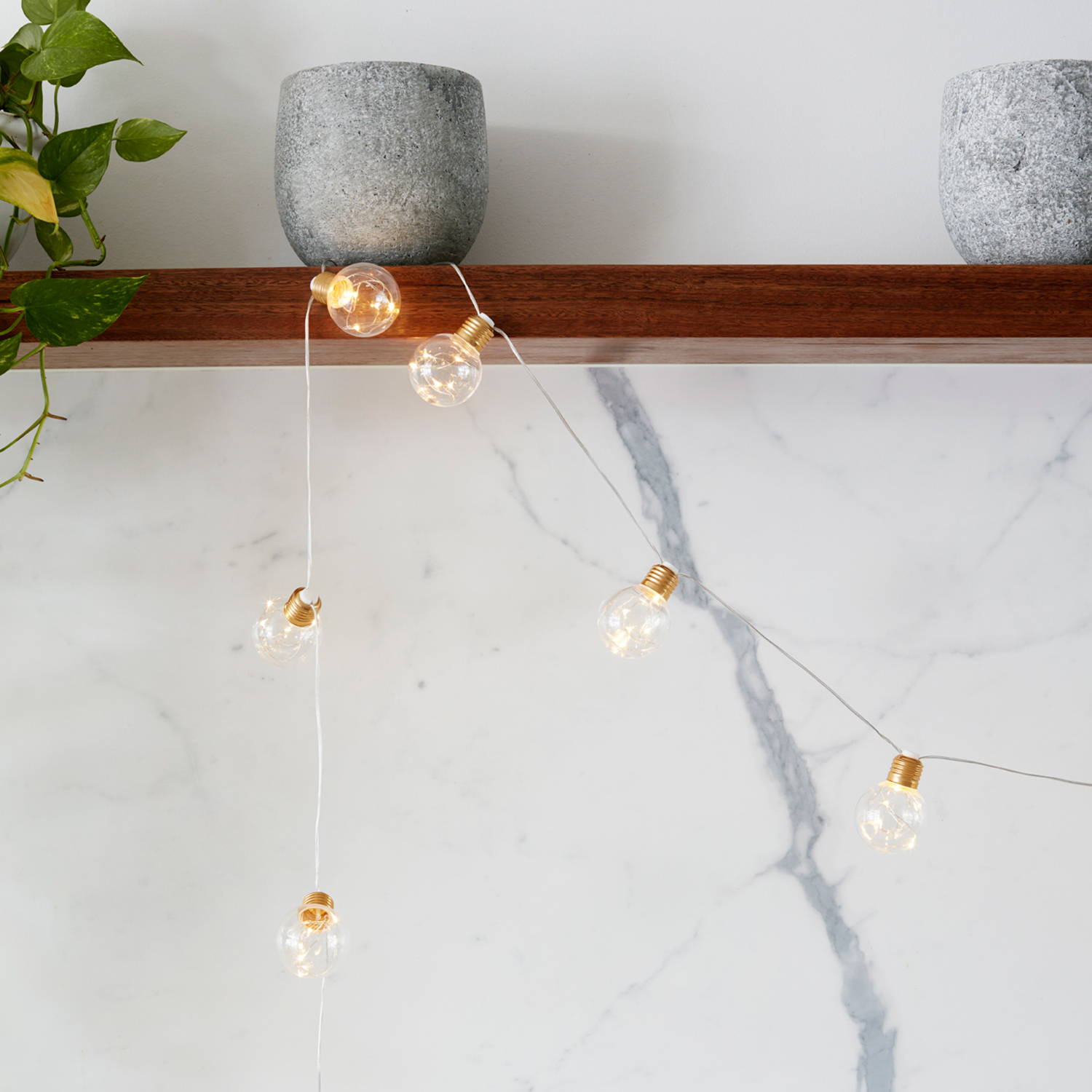 Micro festoons draped along shelf