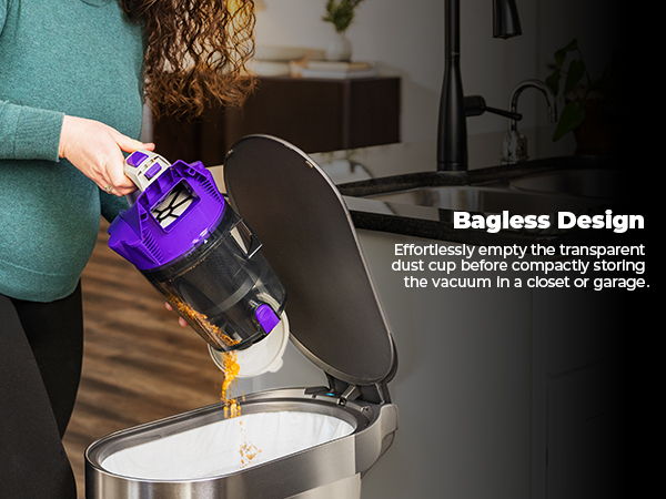 Person emptying a bagless vacuum cleaner into a trash can.