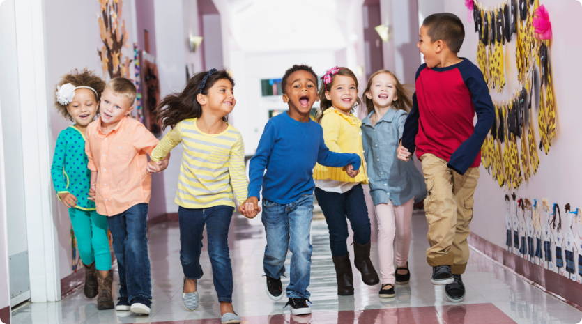 School children running in hall