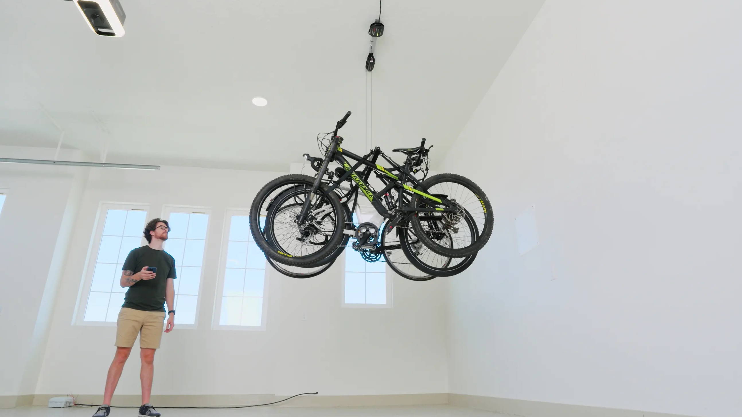SmarterHome Multi-Bike Lifter lifting 3 bikes in a garage