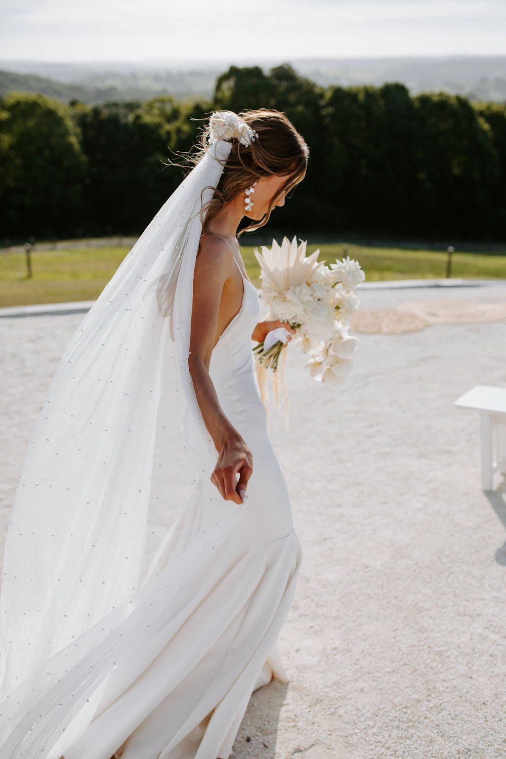 Grace Loves Lace bride wearing the long pearly veil