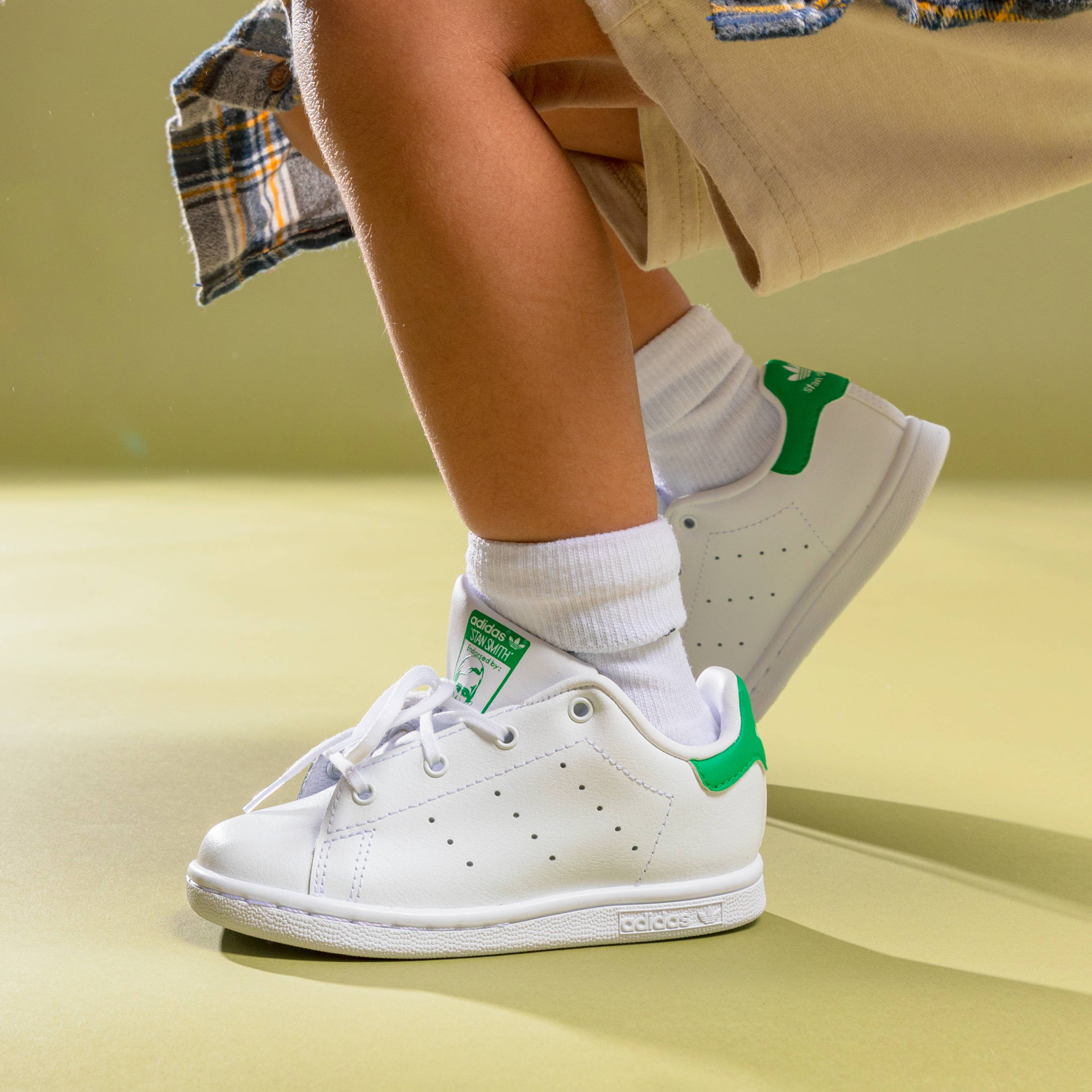 adidas stan smith on child's feet