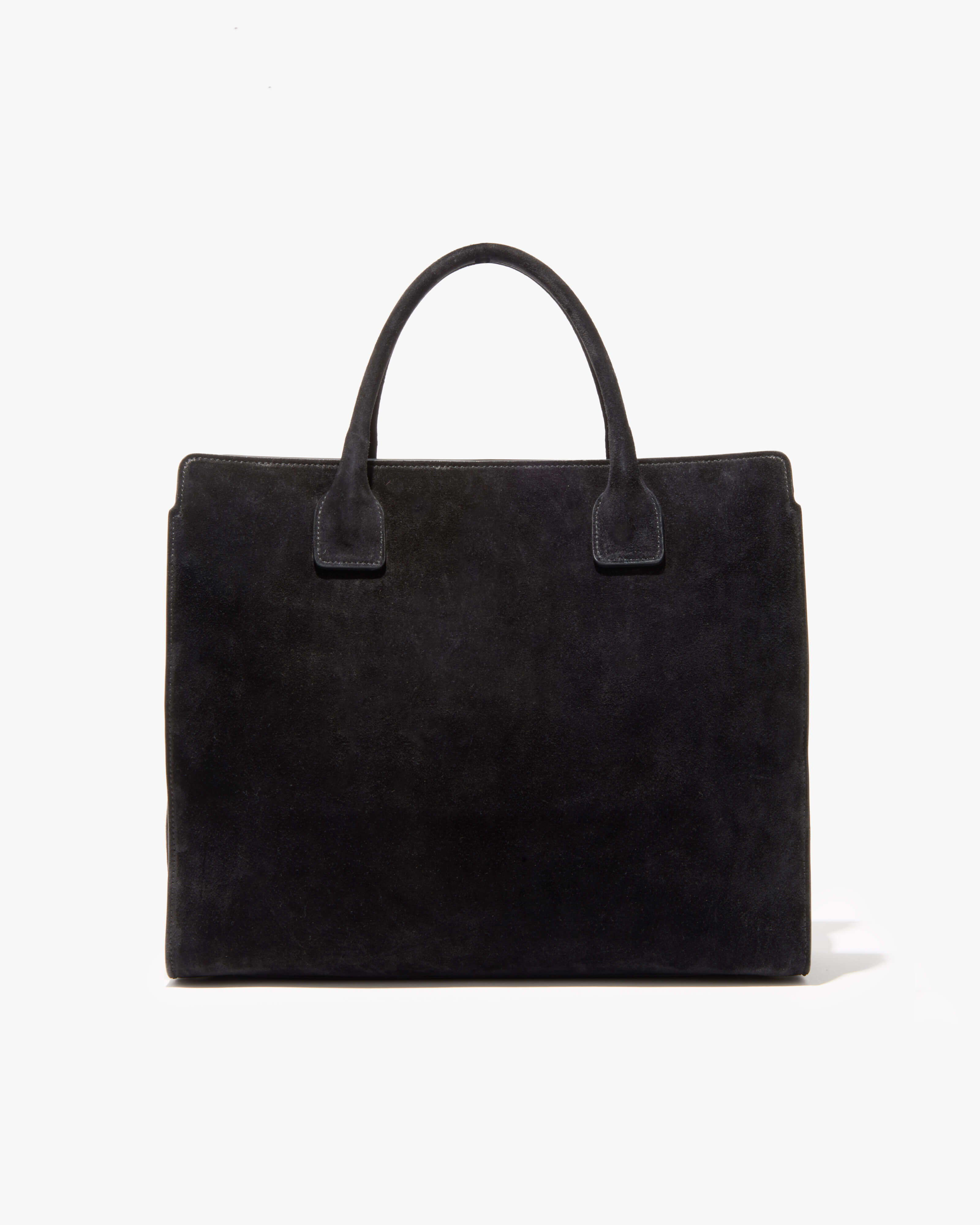 Black suede handbag with two handles and a rectangular shape.
