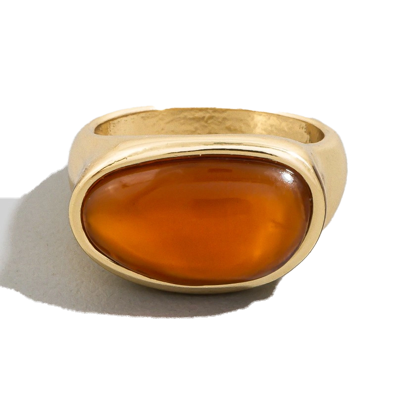Gold ring featuring an oval amber stone.