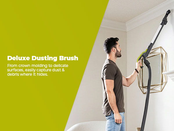 Person using a deluxe dusting brush to clean a ceiling.