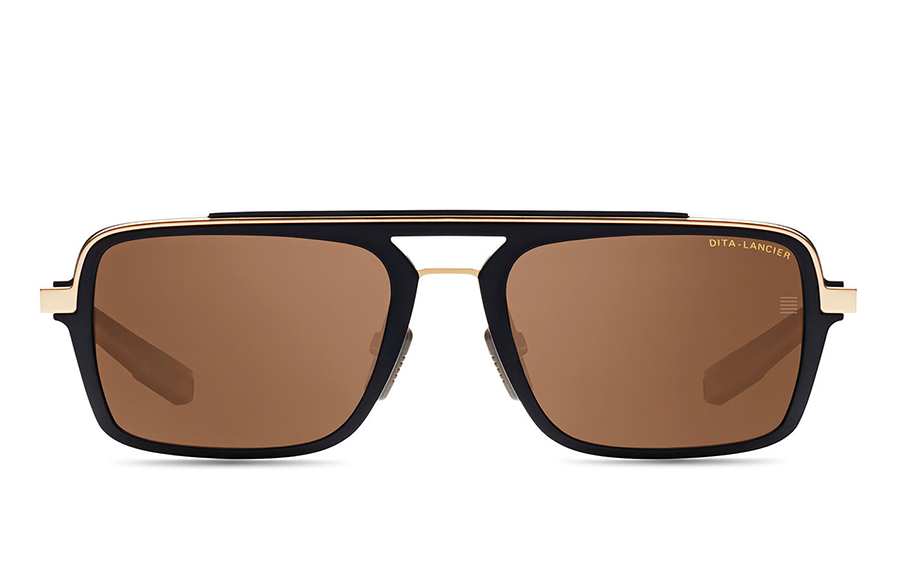 Stylish black and gold sunglasses with brown lenses.
