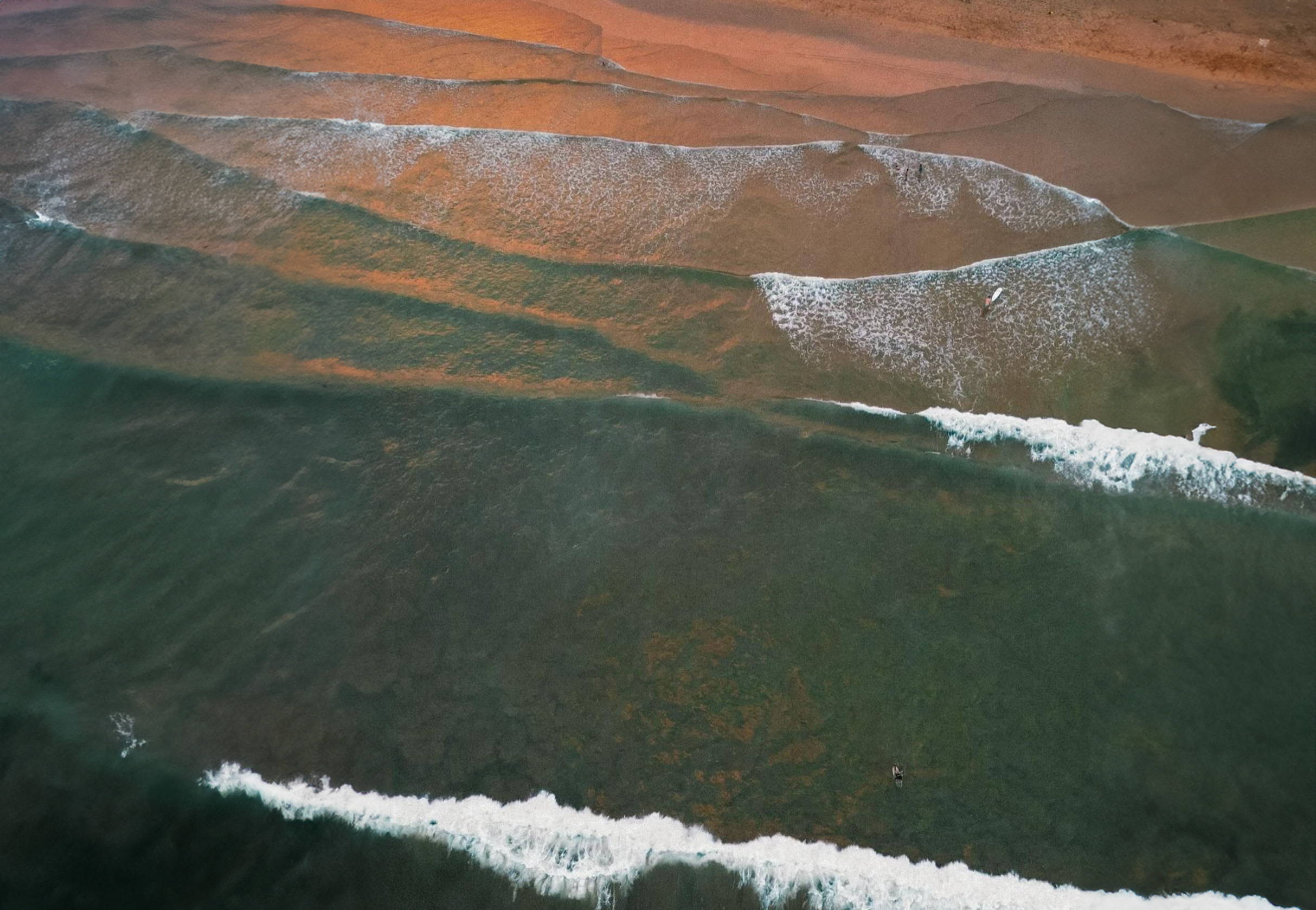 Drone shot of the ocean at golden hour