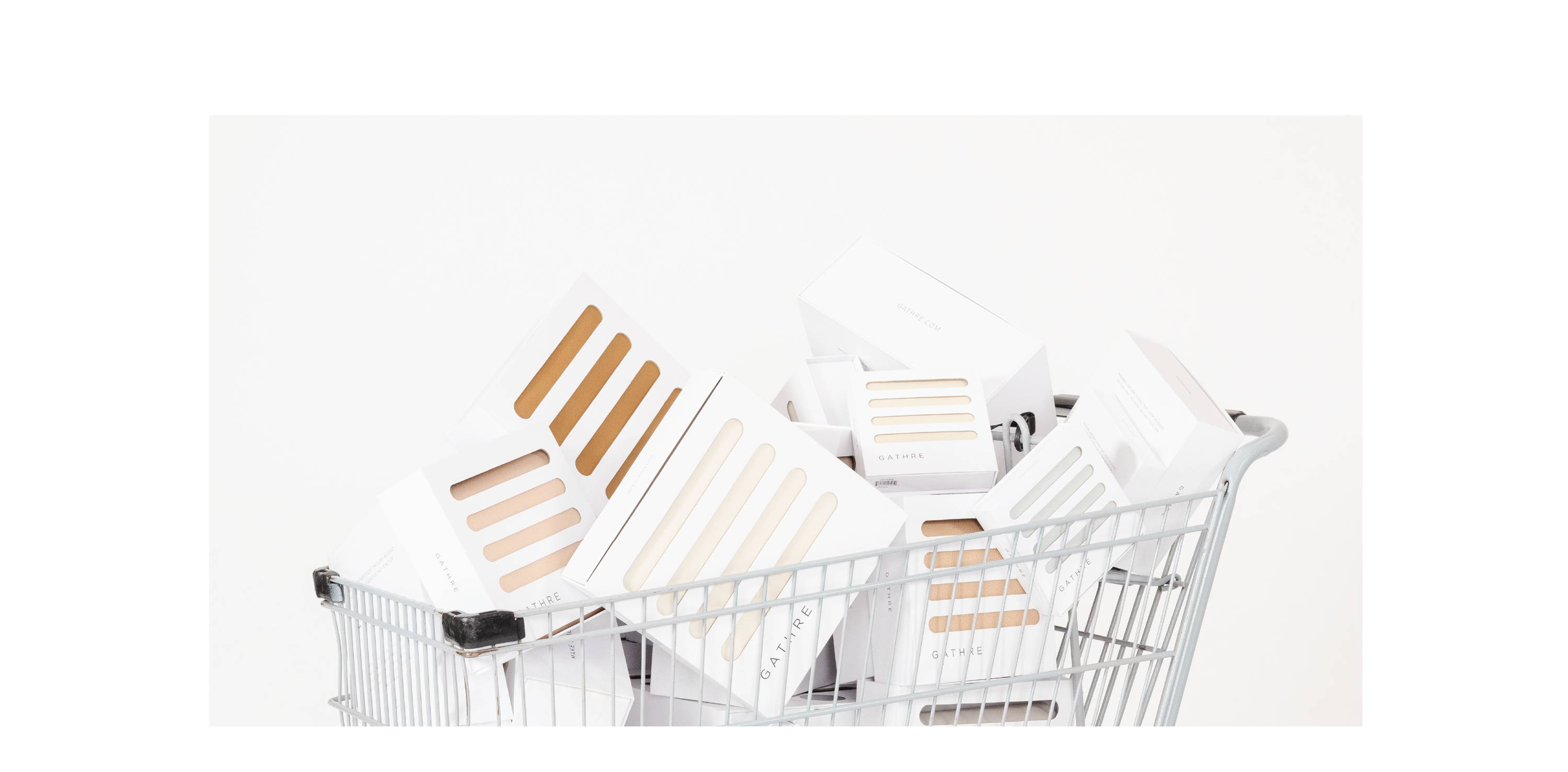 Shopping cart filled with Gathre products in white packaging boxes