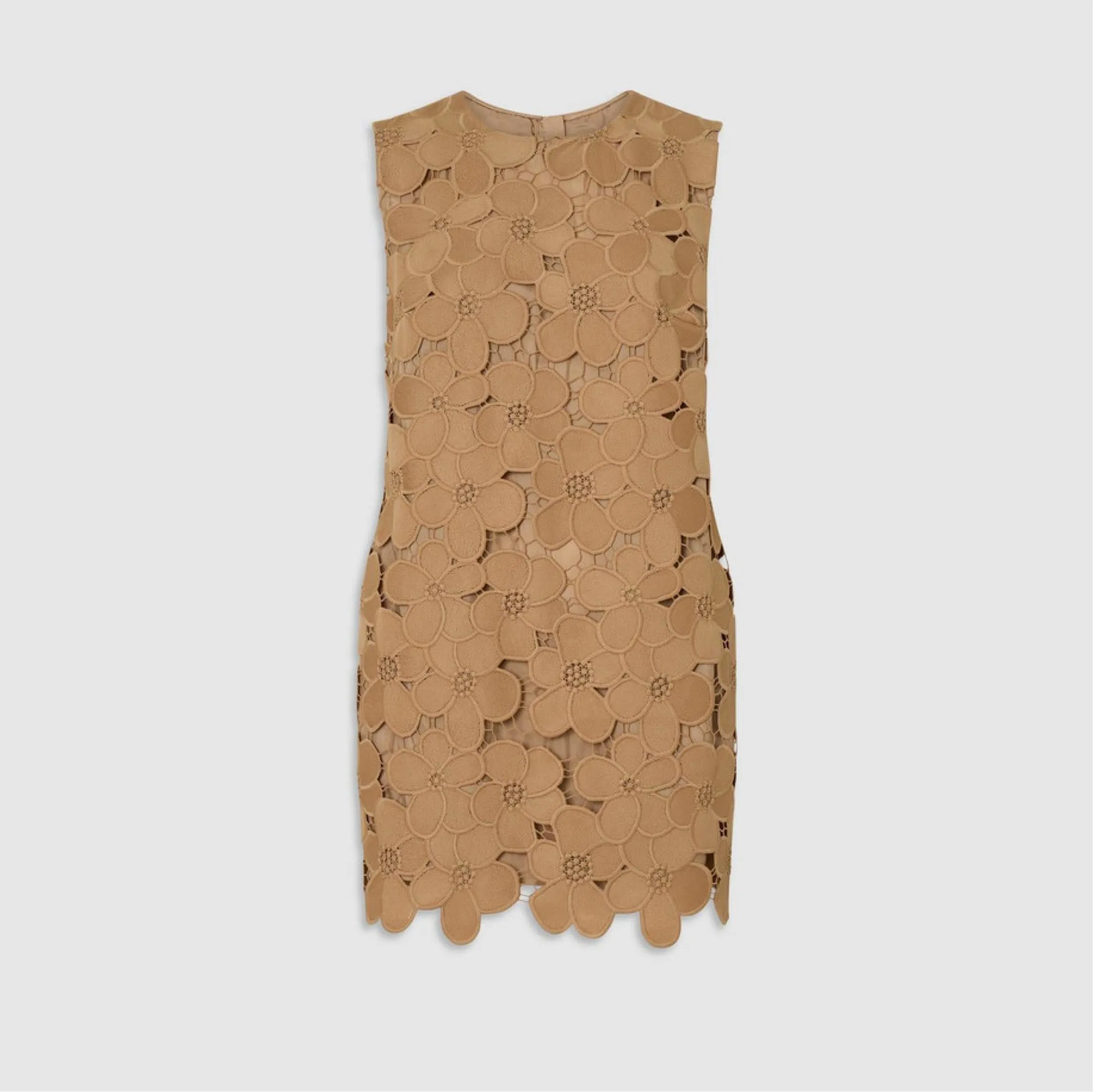 Tan sleeveless dress with circular cutouts and a scalloped hemline.
