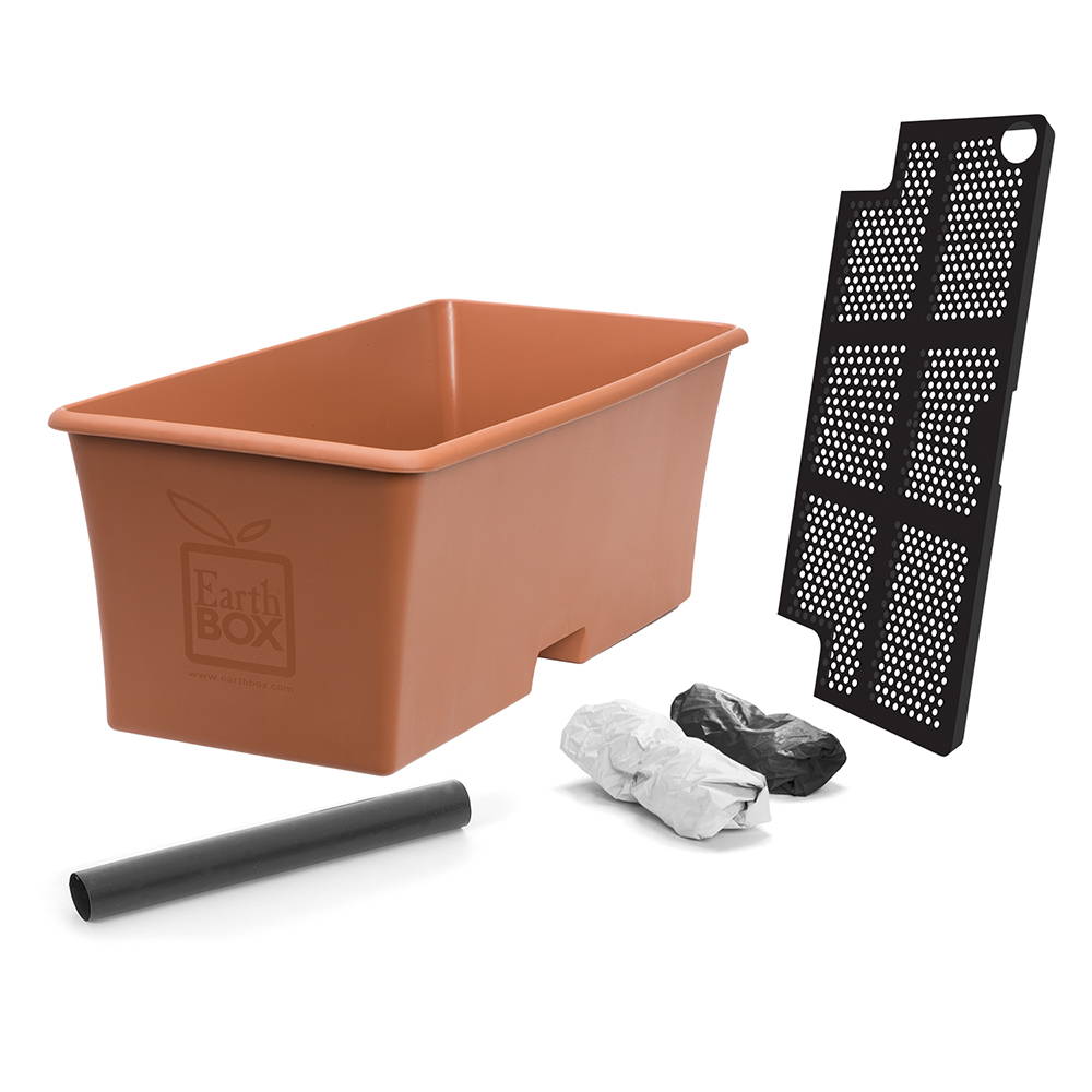 A terracotta EarthBox container with aeration screen, water fill tube, and 2 black & white reversible mulch covers