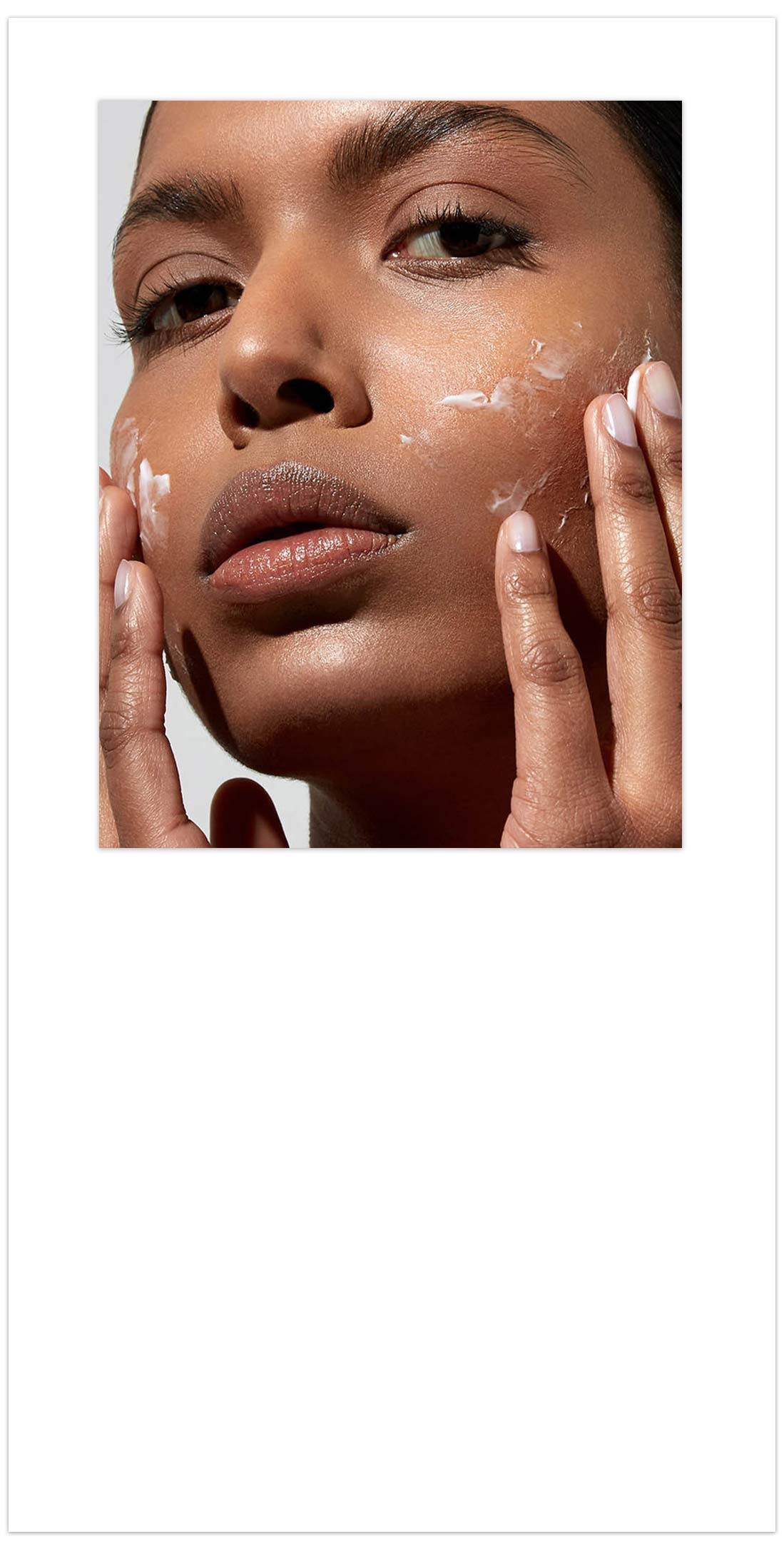 Model applying face cream