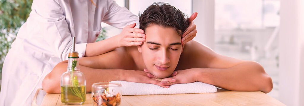 Person receiving a massage in a serene spa environment.