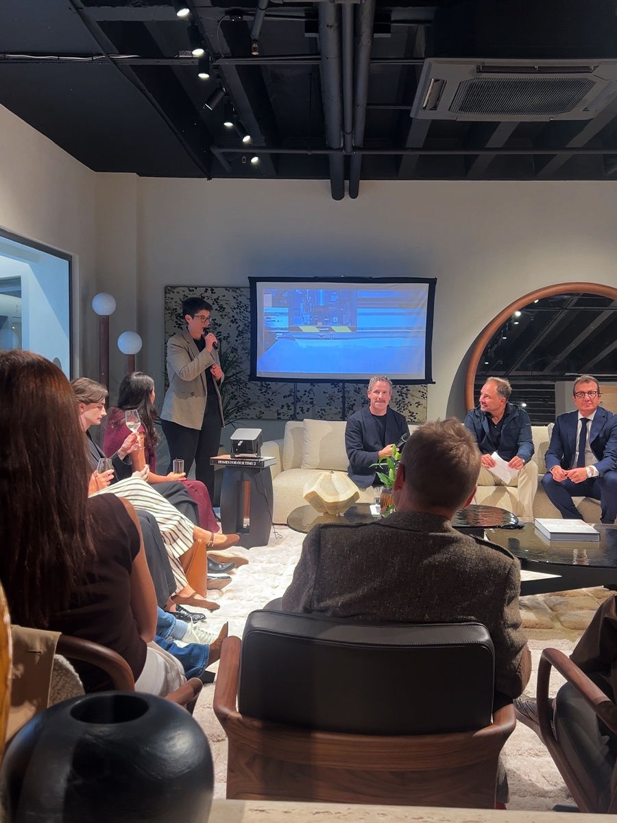 Group of people in the Porada showroom during a presentation.