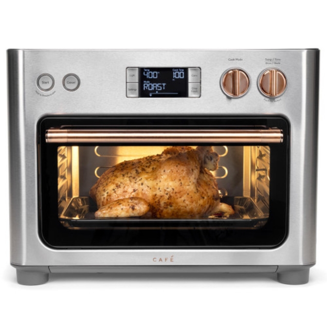 Cafe countertop couture oven with a roasted chicken inside.