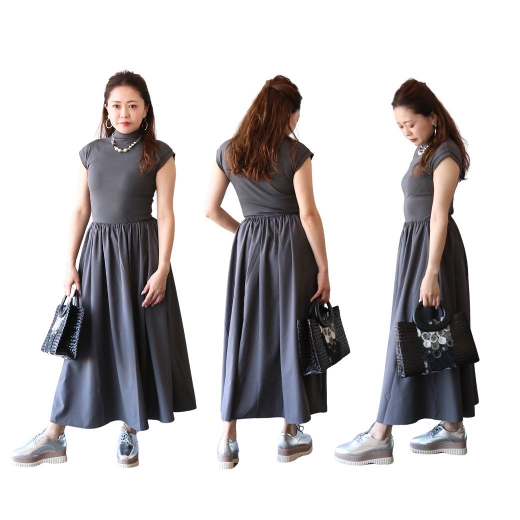 Woman in a gray dress, posing from three angles, holding a handbag.