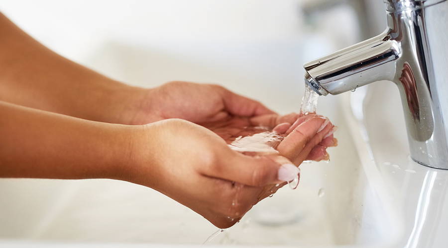 woman holding water in her hands