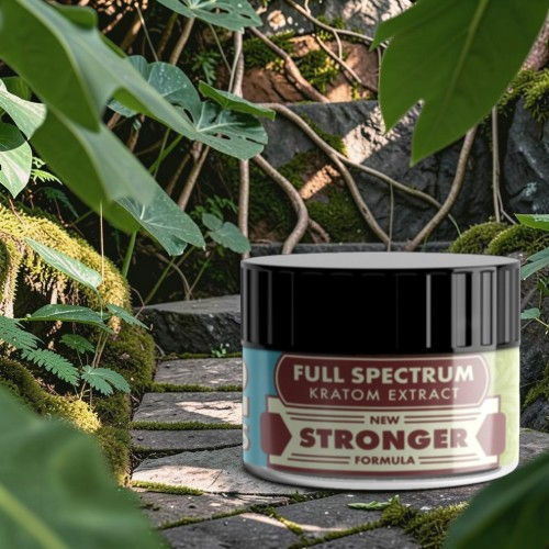 Container of Full Spectrum Kratom Extract surrounded by greenery.
