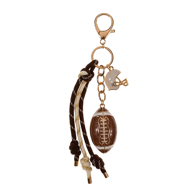 Keychain with football charm and decorative elements.