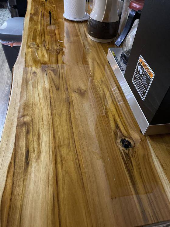 A wooden live-edge coffee epoxy bar top. Made with UltraClear Epoxy.