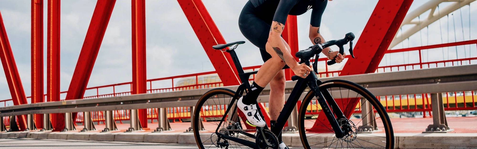 Riding Rondo bikes on a bridge.