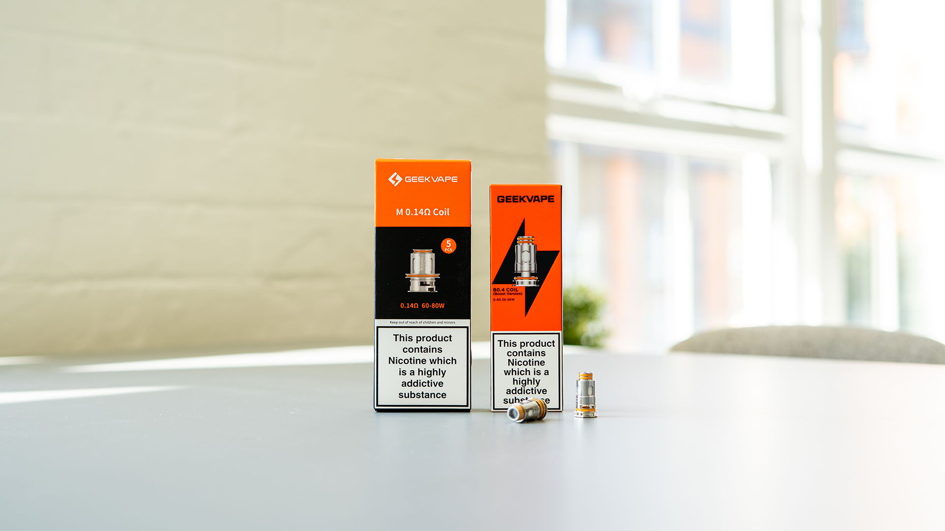 A picture of two packs of Geekvape coils on table