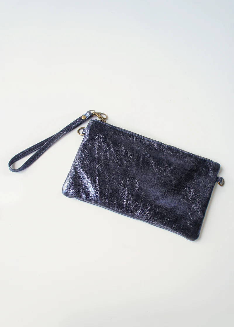 A dark blue metallic clutch bag with a bronze zip and wrist strap