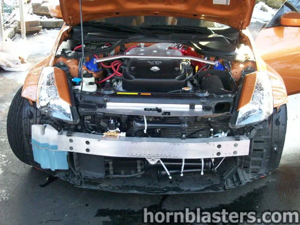 Hood open orange Nissan 350Z bumper removed black train horns impact bar brass solenoid strut brace Nick's Conductor's Special 232 gallery photo 2